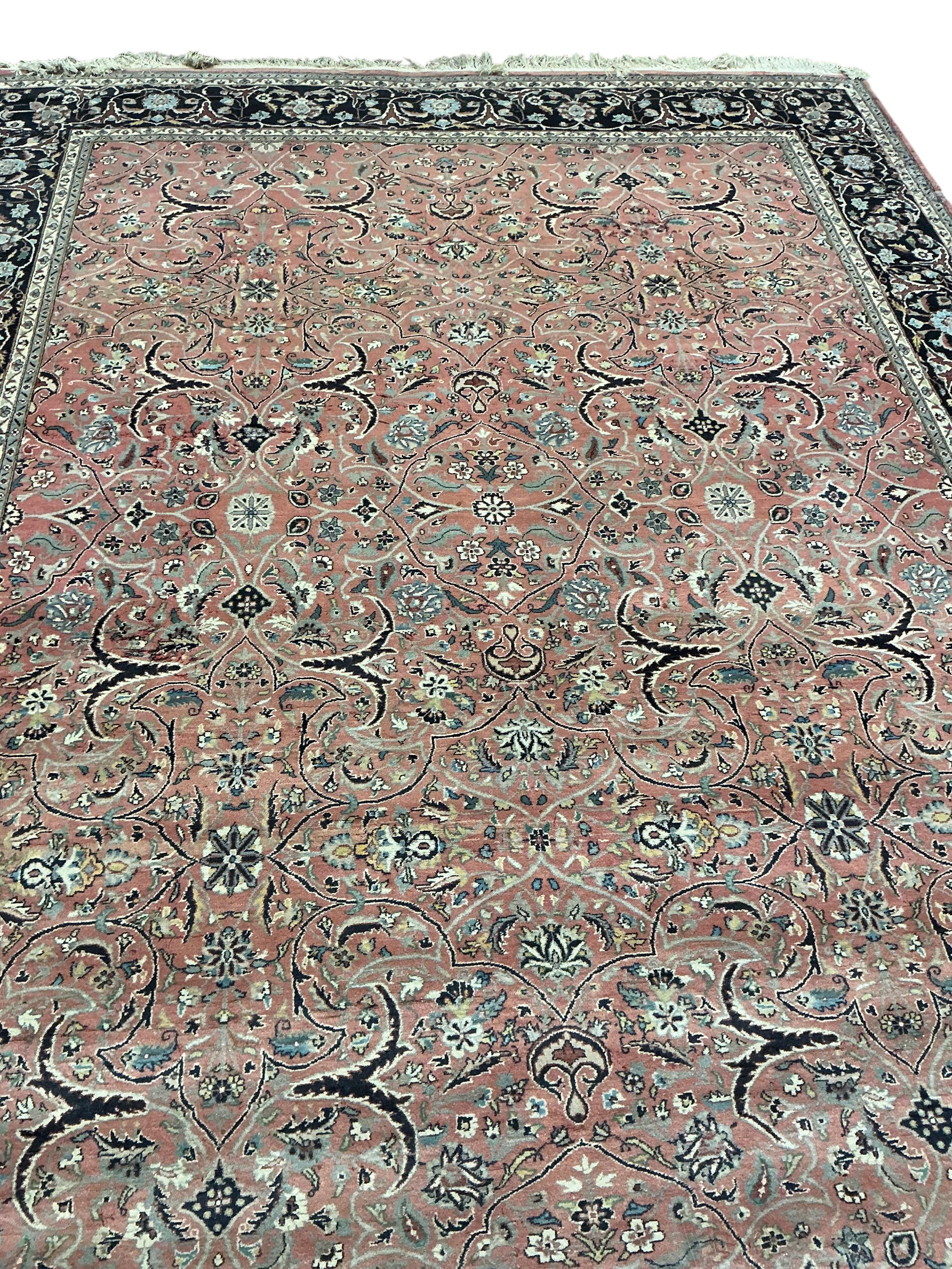A Tabriz peach ground carpet, 330 x 248cm